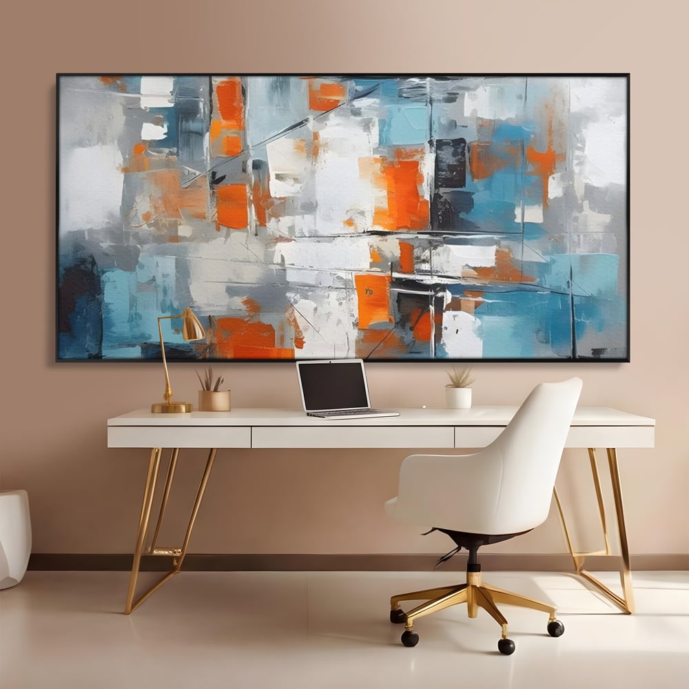 Tablou canvas cu pictura abstracta cu blocuri portocalii si albastre, in rama de aluminiu negru, pe perete intr-un birou